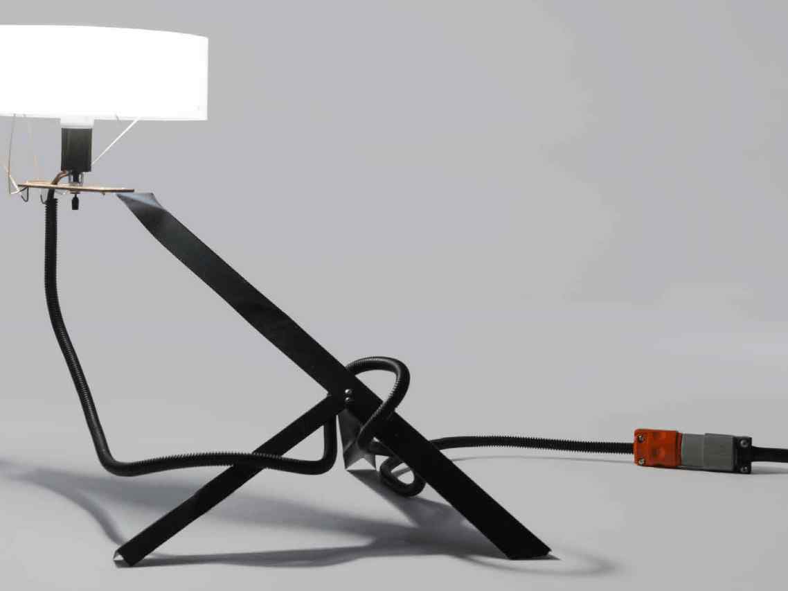image showing a very abstract looking tripod-shaped industrial lamp